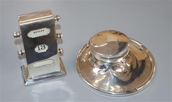 A late 1920s silver inkstand and silver mounted desk calendar.